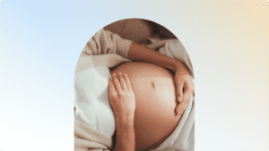 a close-up of a person's pregnant belly