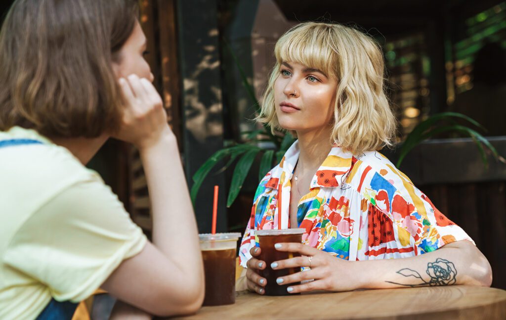 Two woman sitting at a cafe