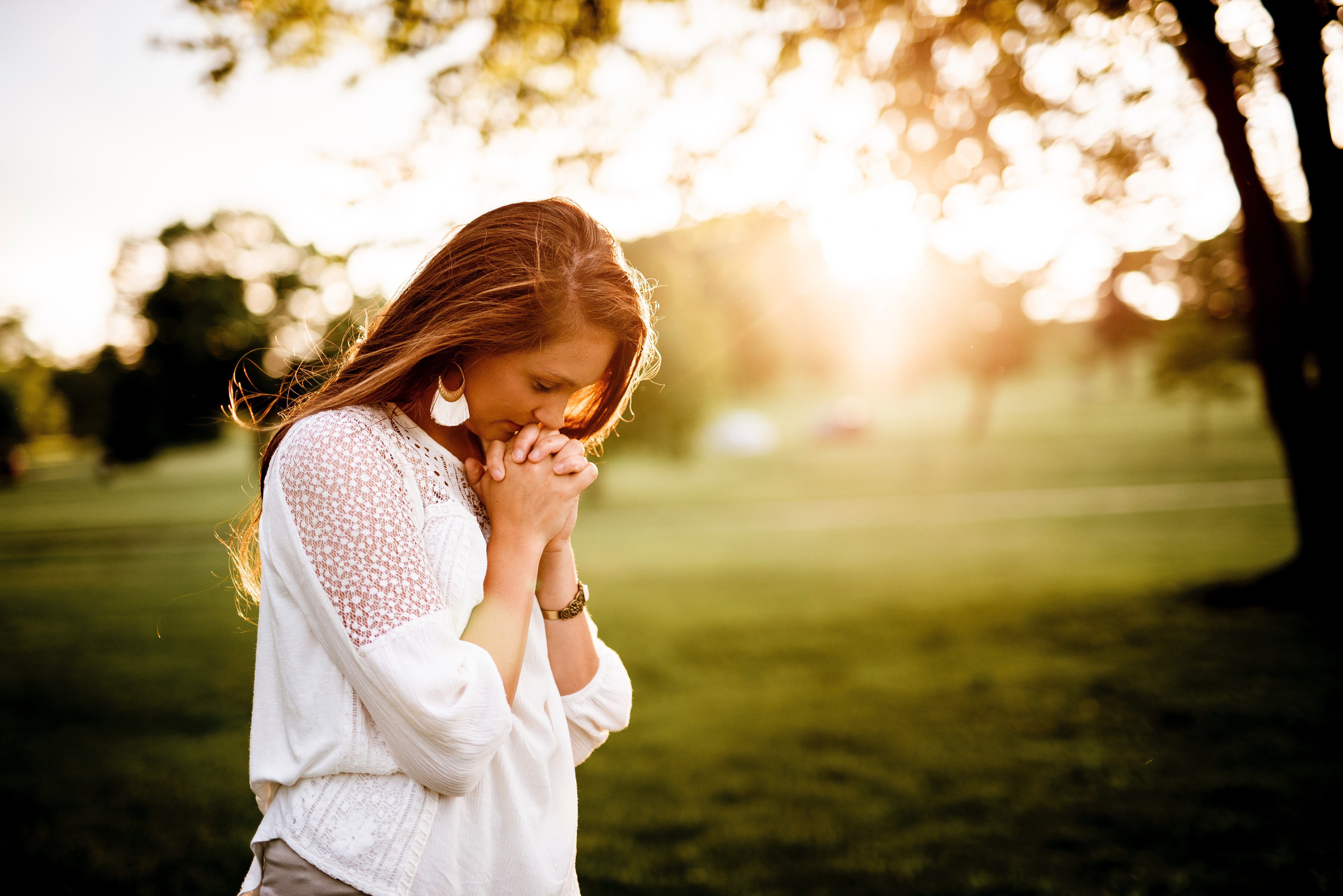 Stressed and anxious woman praying