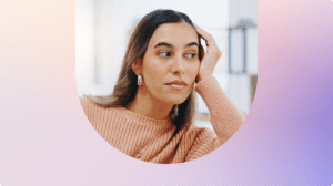 Person resting their head on their hand while looking away